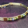Make an unforgettable statement with our one-of-a-kind gemstone Babei collar! Crafted with sterling silver and beautiful Tanzanite gemstone crystal beads, this stunning necklace will instantly add a sophisticated yet daring touch to any look. Dare to be different and be noticed!