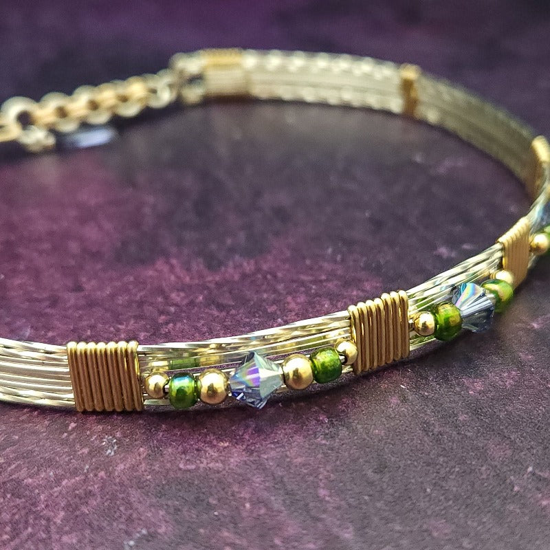Make an unforgettable statement with our one-of-a-kind gemstone Babei collar! Crafted with sterling silver and beautiful Tanzanite gemstone crystal beads, this stunning necklace will instantly add a sophisticated yet daring touch to any look. Dare to be different and be noticed!