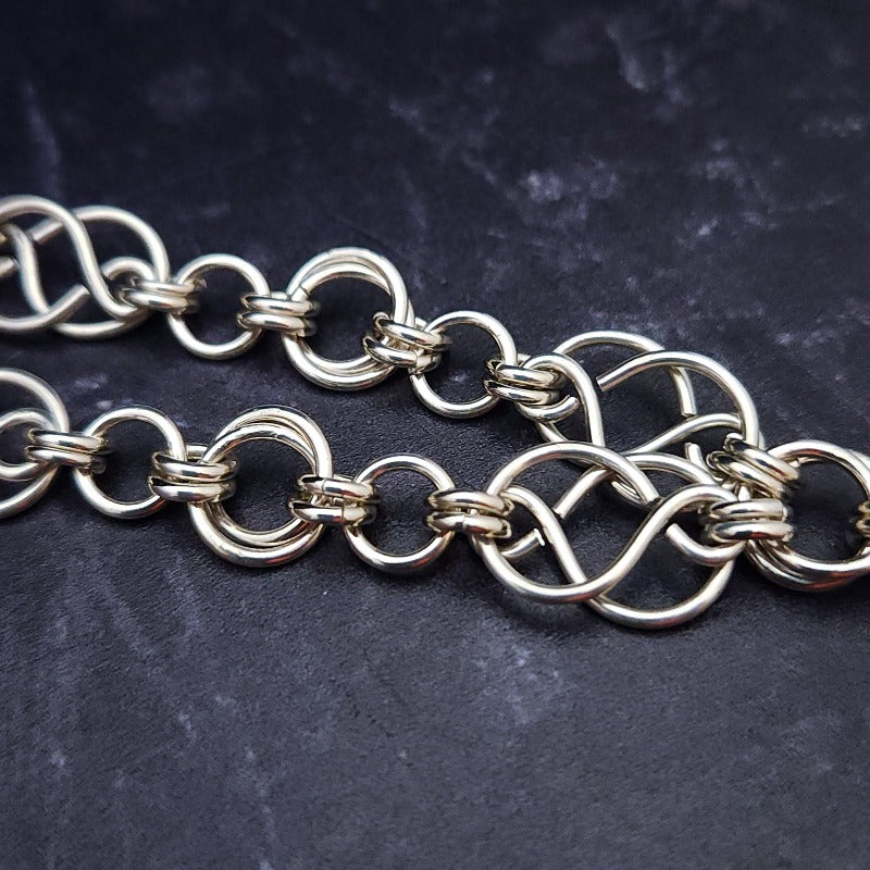 The GUNDOLF Wolf Necklace helps you tap into your inner warrior. Finished with a stainless steel wolf pendant and handcrafted sterling Celtic knot chain, this one-of-a-kind necklace provides long-lasting symbol of strength and courage.