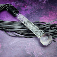 Experience the perfect balance of pleasure and pain with this BDSM Flogger in Black Leather and Glass! Stylish, luxurious, and crafted with great care, it's the classic impact toy of your kinky dreams. Personalize to your heart's content - heat it up or hit it hard - and explore a range of sensations with S&M play! Can be Monogrammed / Engraved. By My Secret Heart Studios