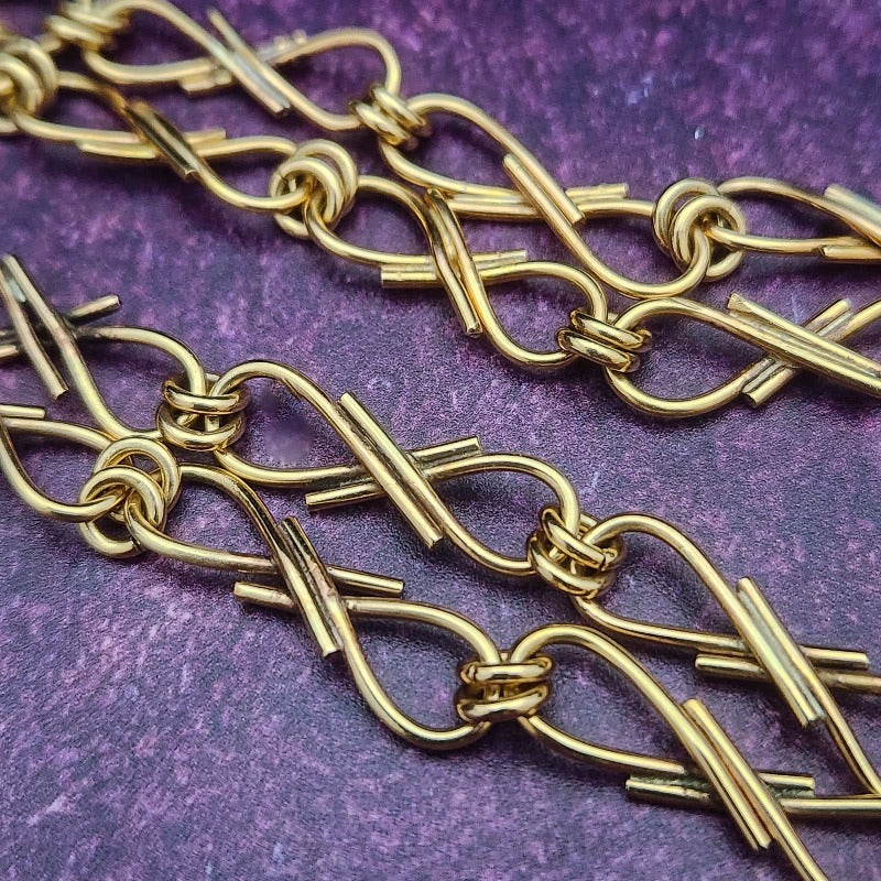 We've all fought battles. And won. I created Embrace to honor the battles. The handcrafted links are interlocked and symbolize the power of love and prayer. The power of loved ones and friends that stand by  you during your raging storms. Choose from a locking submissive style or traditional.