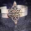 This traditional classic CELTIC DANCE cuff, adorned with a sterling Triquetra Knot, pays homage to the spirited nights of Celtic music and dancing. Its robust design ensures a lifetime of use, while the polished sterling silver offers a lustrous shine that never fades. This timeless piece of Celtic jewelry is sure to be a conversation starter.