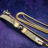 Luxurious BDSM leash for that special time or event. The Golden Snakeskin Leather is accented gold wire wraps and features an earthy toned natural Pyrite gemstone. Riveted for strength. The 35 inch golden brass snake chain is slinky with a sensual feel.  A swivel trigger clip moves with you both for great mobility. This is uber-sexy! My Secret Heart Studios