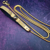 Luxurious BDSM leash for that special time or event. The Golden Snakeskin Leather is accented gold wire wraps and features an earthy toned natural Pyrite gemstone. Riveted for strength. The 35 inch golden brass snake chain is slinky with a sensual feel.  A swivel trigger clip moves with you both for great mobility. This is uber-sexy! My Secret Heart Studios