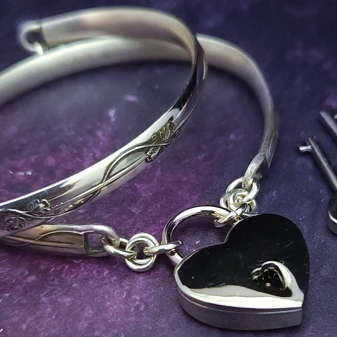 The Art Nouveau locking bracelet is inspired by the art of Alphonse Mucha, with a timeless Art Nouveau floral and vine pattern. This beautiful piece of jewelry is the perfect way to show your devotion and commitment in an empowering way. Choose locking BDSM submissive or traditional closure. By My Secret Heart Studios.