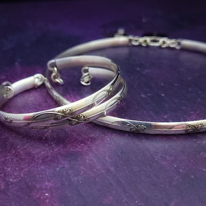 The Art Nouveau locking bracelet is inspired by the art of Alphonse Mucha, with a timeless Art Nouveau floral and vine pattern. This beautiful piece of jewelry is the perfect way to show your devotion and commitment in an empowering way. Choose locking BDSM submissive or traditional closure. By My Secret Heart Studios.