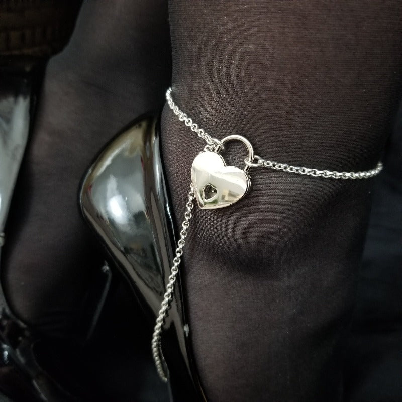 Be ready for the night with this simple yet seductive Locking Heel Anklet! Simply slip the chain around the heel of the stilettos / shoe, then lock the ankle chain. Effortless BDSM statement of Ownership. Easy, stylish, and scorching! By My Secret Heart Studios