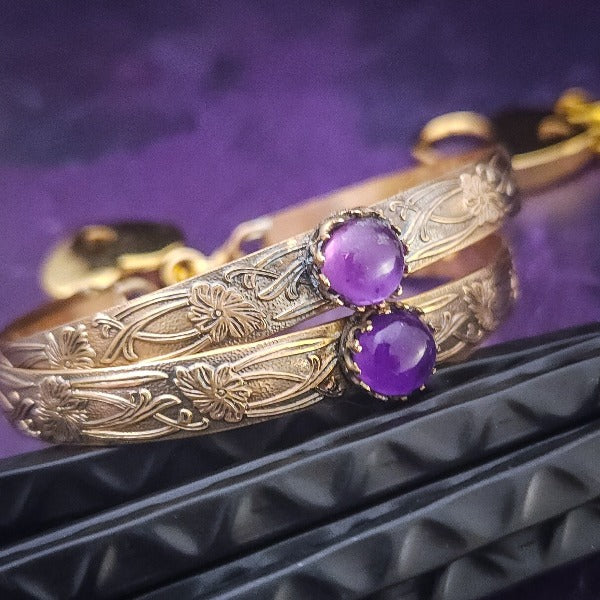 Show your ownership or submission with style and grace. Our best selling ‘SOFT and SWEET’ Locking BDSM submissive locking bracelets are now available in anklets sizes as well. These artisan locking bracelet / anklets are hand crafted in a pretty feminine floral pattern of 14k Gold-Filled and natural Amethyst. The epitome of feminine grace. 
