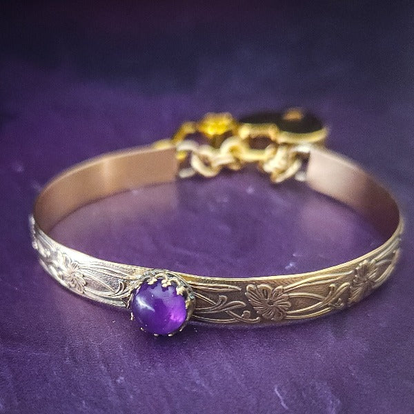 Show your ownership or submission with style and grace. Our best selling ‘SOFT and SWEET’ Locking BDSM submissive locking bracelets are now available in anklets sizes as well. These artisan locking bracelet / anklets are hand crafted in a pretty feminine floral pattern of 14k Gold-Filled and natural Amethyst. The epitome of feminine grace. 