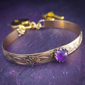 Show your ownership or submission with style and grace. Our best selling ‘SOFT and SWEET’ Locking BDSM submissive locking bracelets are now available in anklets sizes as well. These artisan locking bracelet / anklets are hand crafted in a pretty feminine floral pattern of 14k Gold-Filled and natural Amethyst. The epitome of feminine grace. 