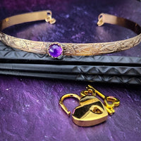 Our Soft and Sweet submissive collar is the epitome of feminine grace. Handcrafted with loving care, this artisan-made 14k gold filled submissive collar radiates femininity with its floral sterling silver pattern and a hand-set 8mm Amethyst. Beautifully feminine and romantic.