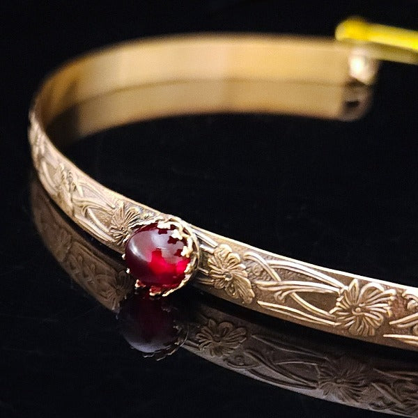Our NEW GOLD & GARNET Soft and Sweet submissive collar and cuffs are the epitome of feminine grace. Handcrafted with loving care, these artisan-made 14k gold filled submissive collars and cuffs radiate femininity with a floral pattern and a hand-set 8mm Natural Amethyst. Beautifully feminine and romantic.