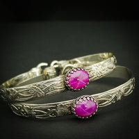 THESE LIMITED EDITION LOCKING BRACELETS are part of our SOFT and SWEET Collection and are created in a classic floral pattern of sterling silver and embellished with a luxurious Star Ruby Cabochon. A romantic, elegant way to show you Ownership / submission. Beautifully feminine and romantic. By My Secret Heart Studios