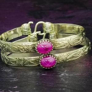 THESE LIMITED EDITION LOCKING BRACELETS are part of our SOFT and SWEET Collection and are created in a classic floral pattern of sterling silver and embellished with a luxurious Star Ruby Cabochon. A romantic, elegant way to show you Ownership / submission. Beautifully feminine and romantic. By My Secret Heart Studios