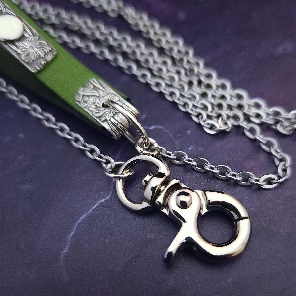 Never settle for ordinary when you can have extraordinary! Our submissive pet leash is handcrafted and One Of A Kind. Bright and clear Peridot green leather is accented with a plaque of our beloved Soft and Sweet pattern in sterling, and boast a rose cut amethyst cabochon for some glitz and glamour.