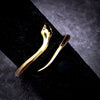 This sleek and sinuous ring boasts a bypass design that artfully mimics a lifelike snake shape, with its head and tail curling into the ends of the ring. Easily adjustable, this ring can fit a wide range of sizes. This ring seamlessly blends art and style, adding a touch of whimsy to your everyday style. 