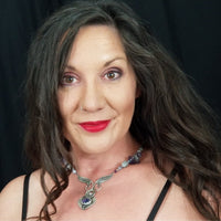 Wear the Velavee Angel Necklace and radiate your inner goddess! Crafted from sterling silver and the rare gemstone Charoite, this one-of-a-kind necklace is adorned with angel wing and a inverted fan shaped medallion, creating a beautiful and unique statement. By My Secret Heart Studios
