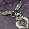 Wear the Velavee Angel Necklace and radiate your inner goddess! Crafted from sterling silver and the rare gemstone Charoite, this one-of-a-kind necklace is adorned with angel wing and a inverted fan shaped medallion, creating a beautiful and unique statement. 
