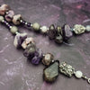 Wear the Velavee Angel Necklace and radiate your inner goddess! Crafted from sterling silver and the rare gemstone Charoite, this one-of-a-kind necklace is adorned with angel wing and a inverted fan shaped medallion, creating a beautiful and unique statement. 