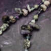 Wear the Velavee Angel Necklace and radiate your inner goddess! Crafted from sterling silver and the rare gemstone Charoite, this one-of-a-kind necklace is adorned with angel wing and a inverted fan shaped medallion, creating a beautiful and unique statement. 