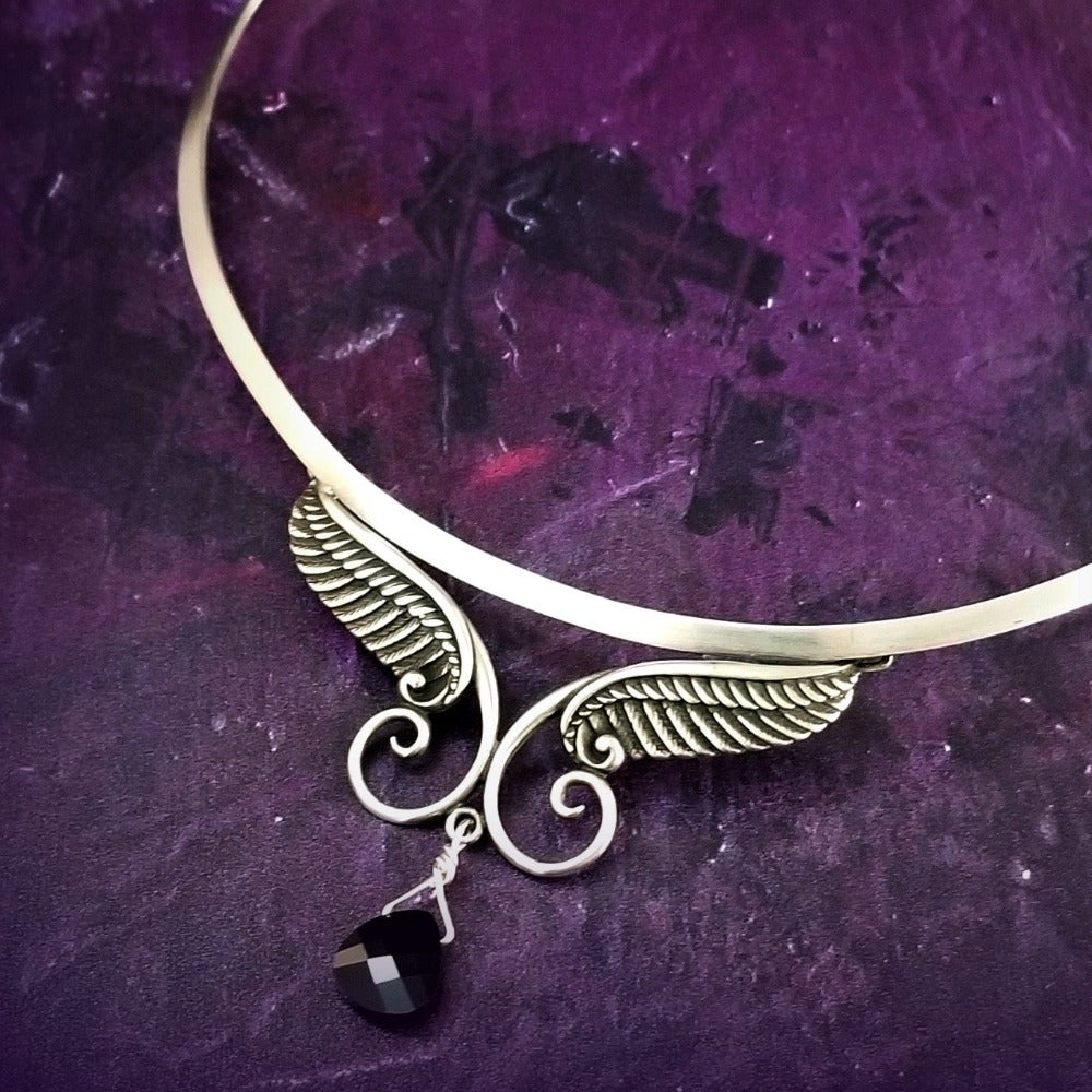 For Your Angel. (Even brats look like the sweet little angels in this collar, lol.) Sterling silver with a faceted briolette drop in Black Onyx crystal. Traditional hook and eye clasp.