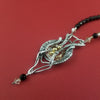Hand woven pendant with sterling silver wire, Golden Shadow Swarovski crystals and black onyx faceted beads.