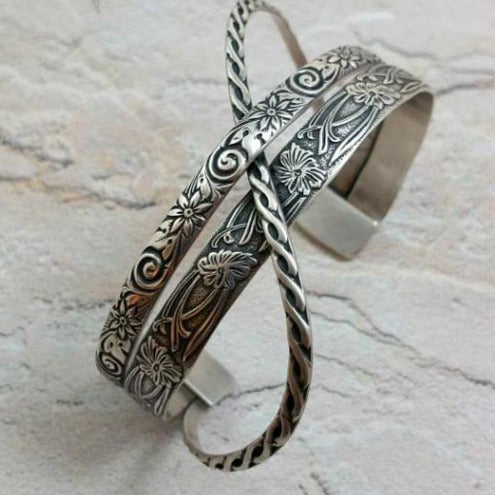 Bold. Dramatic. Original. Our CROSSOVER CUFFS have three patterns of sterling silver, each gently crossing over and through the others to form a unique cuff bracelet. This is the perfect companion for almost all of our collections.