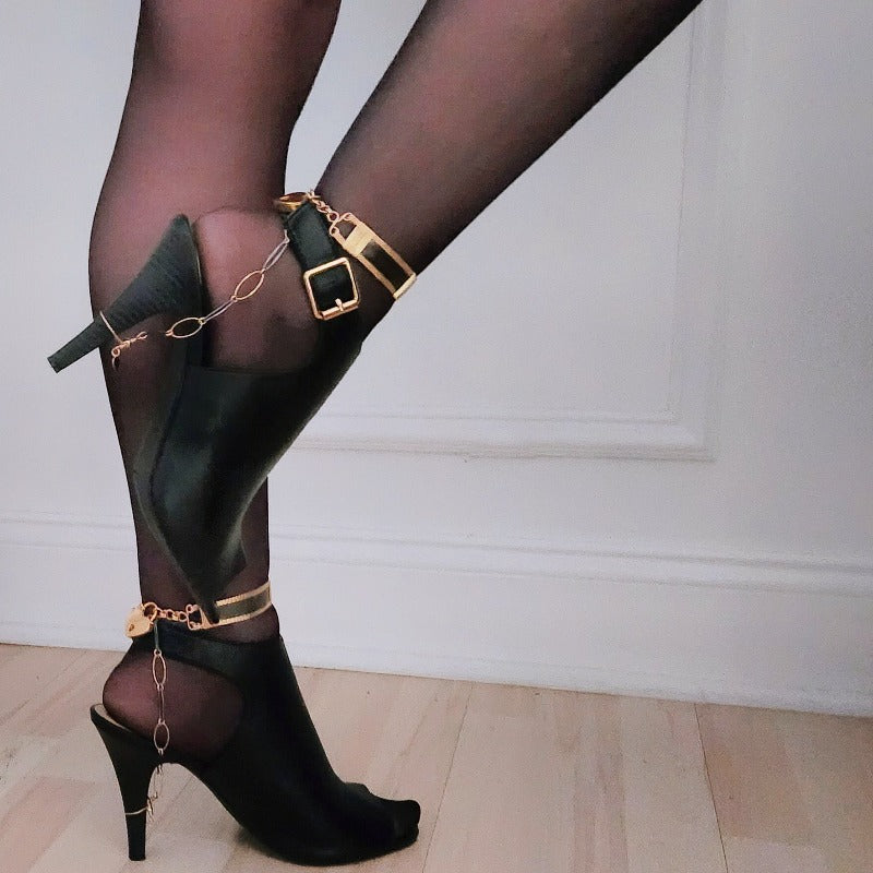 Slip the golden ring around the heel of your stilettoes, and the other ring into the lock of your locking ankle bracelet and voila, you now have on locked heels. Sweet. Simple. Sexy as hell!