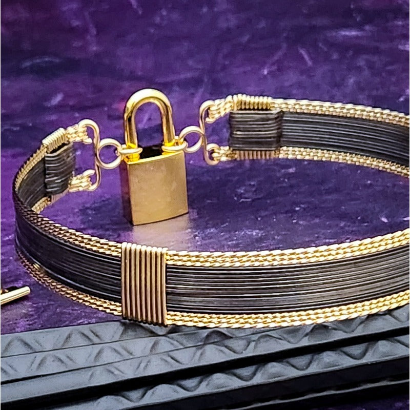 Be daring and adventurous with your style with the AMARI BDSM Submissive Collar. Crafted from a luxurious combination of blackened sterling silver and surrounded by hand twisted accents, this collar will take you from dusk till dawn with an eye-catching elegance that will turn heads wherever you go. 