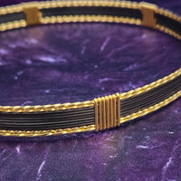 Be daring and adventurous with your style with the AMARI BDSM Submissive Collar. Crafted from a luxurious combination of blackened sterling silver and accented with twisted gold, this collar will take you from dusk till dawn with an eye-catching elegance that will turn heads wherever you go. 
