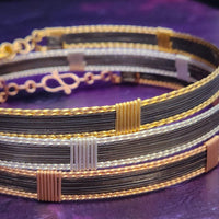 Be daring and adventurous with your style with the AMARI BDSM Submissive Collar. Crafted from a luxurious combination of blackened sterling silver and accented with twisted gold, this collar will take you from dusk till dawn with an eye-catching elegance that will turn heads wherever you go. 