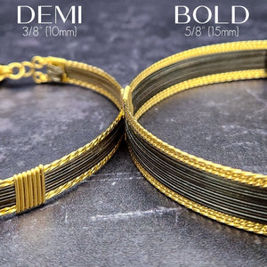 Be daring and adventurous with your style with the AMARI BDSM Submissive Collar. Crafted from a luxurious combination of blackened sterling silver and accented with twisted gold, this collar will take you from dusk till dawn with an eye-catching elegance that will turn heads wherever you go.