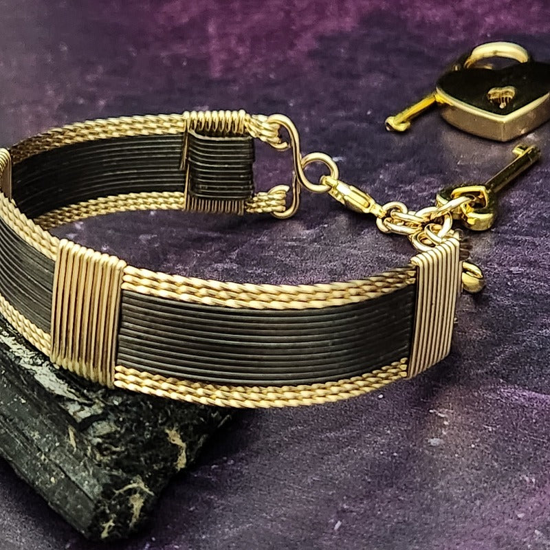 Discover a daring and captivating style with the AMARI V STYLE BDSM Submissive Collar. Crafted from a sumptuous blend of blackened sterling silver and complemented with hand twisted accents, this collar will be a striking statement of elegance from day to night. Experience urban chic with a hint of gothic glamour!