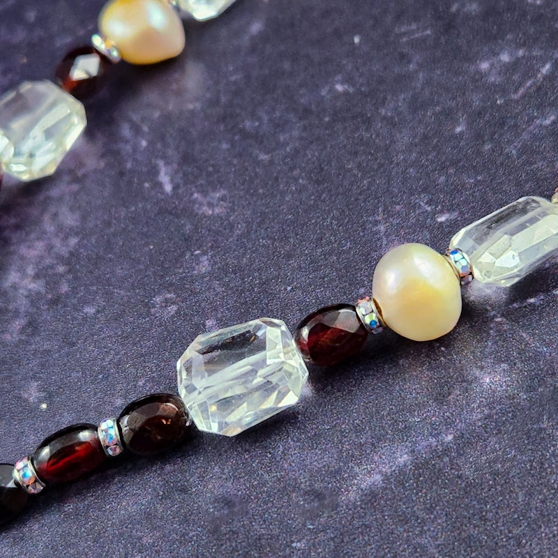 This ONE OF A KIND locking submissive ANGEL WING GEMSTON E COLLAR pays homage to your BDSM D/s lifestyle with beauty and grace. Locks in front. GEMSTONES: Faceted Amethyst Nuggets, Cushion Cut Labradorite , Faceted Tanzanite Rondels & Faceted Grey Moonstone