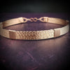 Showcase your power and taste with ASHANTI Slim Collar. This handcrafted collar is artfully crafted with twisted 14K gold filled wire and elevated with gold wraps. A touch of chain in the back ensures a snug fit, so you can move with ease. Wear ASHANTI TWISTED alone or layer it with other chains and pendants--it's the perfect foundation for building endless elegant looks! Plus, the locking collar takes your look up a notch.