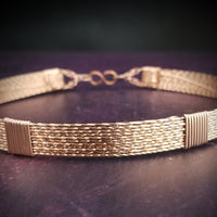 Showcase your power and taste with ASHANTI Slim Collar. This handcrafted collar is artfully crafted with twisted 14K gold filled wire and elevated with gold wraps. A touch of chain in the back ensures a snug fit, so you can move with ease. Wear ASHANTI TWISTED alone or layer it with other chains and pendants--it's the perfect foundation for building endless elegant looks! Plus, the locking collar takes your look up a notch.
