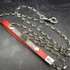 Classic BDSM red and black create a unique One Of A Kind BDSM leash with a bit of drama. The red leather is accented with a plaque of our Soft and Sweet pattern in sterling, and features an unusual black druzy gemstone. 