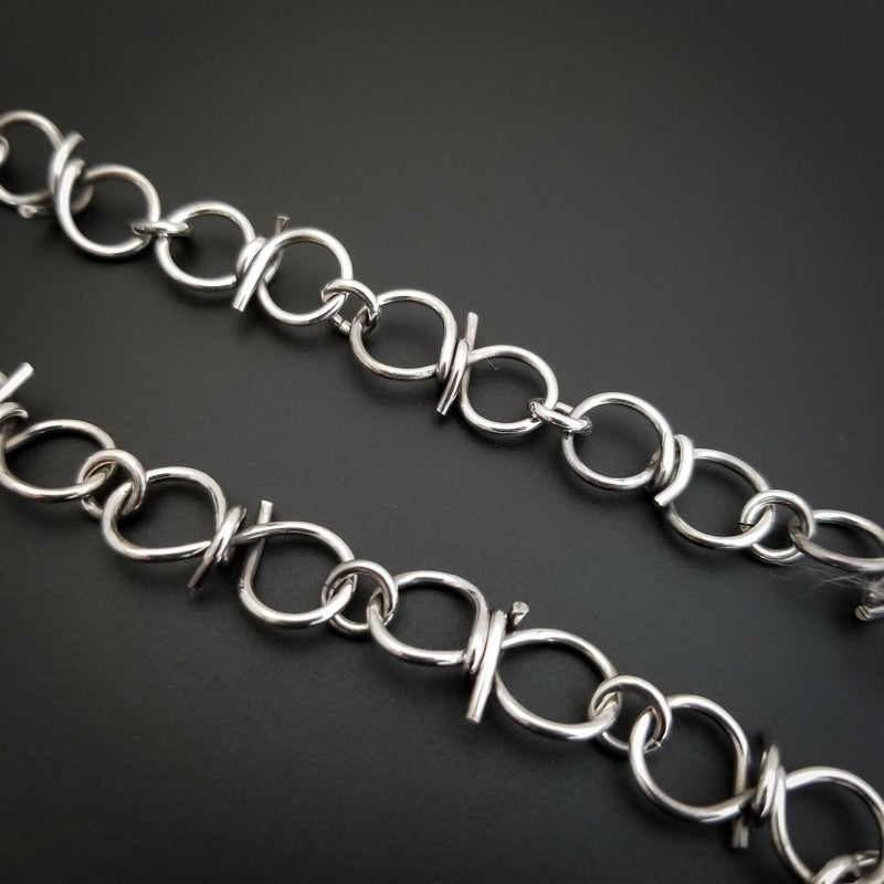Our version of a Barbed Wire Collar, this beast is from our Brambles Collection, inspired by barbs, thorns and prickly things. This BDSM LOCKING SUBMISSIVE COLLAR is thick, hefty and truly badass. I create the barbs with comfort in mind, they're smooth and aren't long enough to do real damage, but still just a touch dangerous ;D