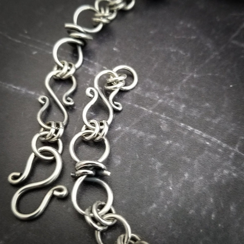 Our version of a Barbed Wire Collar, this beast is from our Brambles Collection, inspired by barbs, thorns and prickly things. This BDSM LOCKING SUBMISSIVE COLLAR is thick, hefty and truly badass. I create the barbs with comfort in mind, they're smooth and aren't long enough to do real damage, but still just a touch dangerous ;D