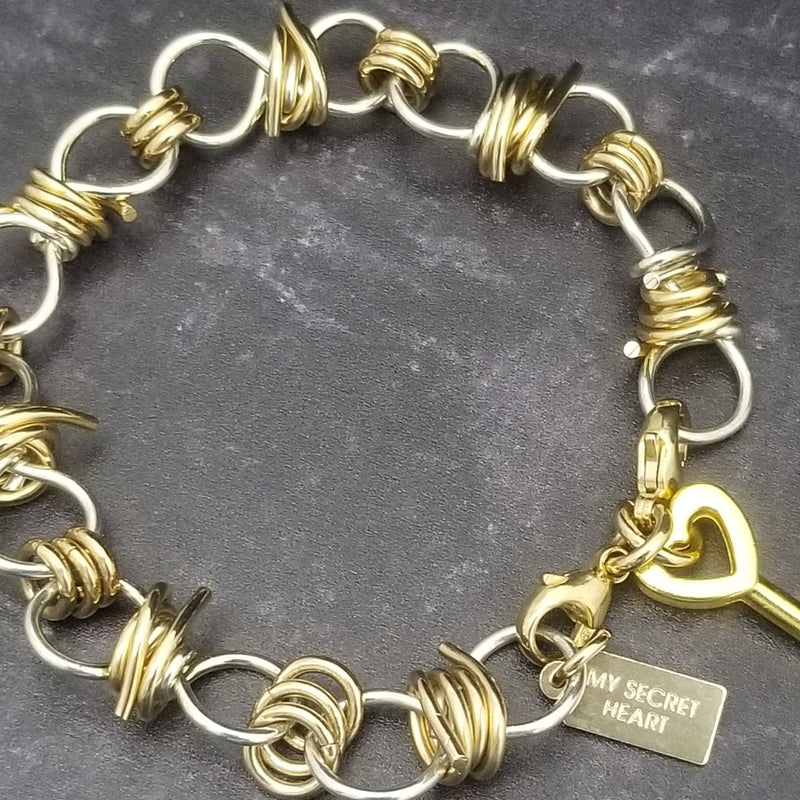 Dominant's Key Cuffs are created with a detachable chain that holds the key to Your slave or sub's locked collars or cuffs. Jewelry clasps clip into rings that attach to the cuff, which makes removing the chain simple. You can even attach it to Your slave's collar during play for safe keeping. 
