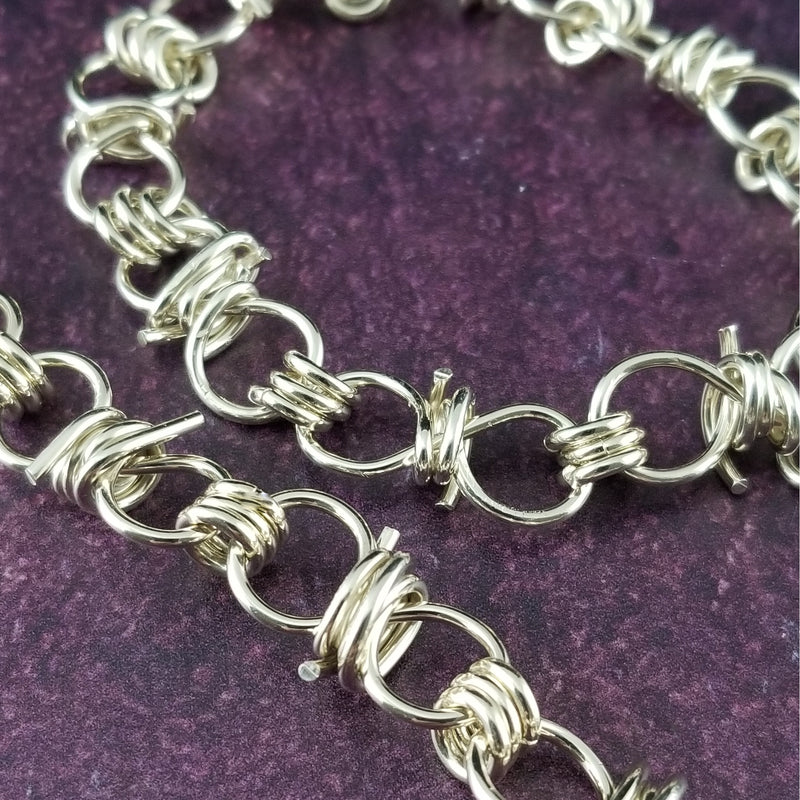 Dominant's Key Cuffs are created with a detachable chain that holds the key to Your slave or sub's locked collars or cuffs. Jewelry clasps clip into rings that attach to the cuff, which makes removing the chain simple. You can even attach it to Your slave's collar during play for safe keeping. My Secret Heart Studios