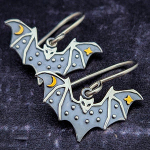 Look at these darling little bats! Great addition to your gothic collection. Earrings made of sterling silver bats with a gold star and crescent moon. My Secret Heart Studios