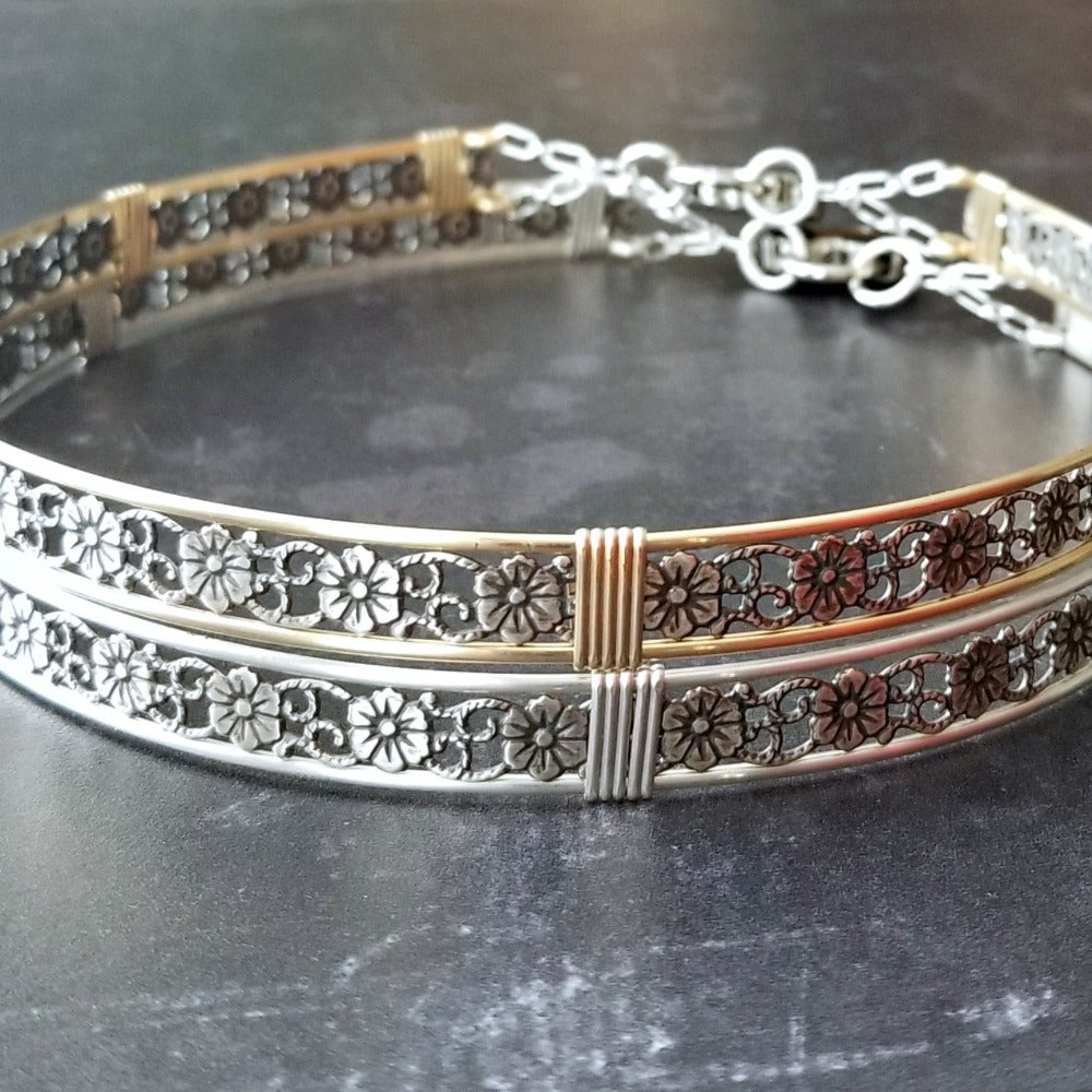 Our most delicate and feminine submissive locking collar. A simply sweet floral and vine pattern of sterling silver and wire wrapped with precious metal accents. BDSM? No one will know. Totally discreet.