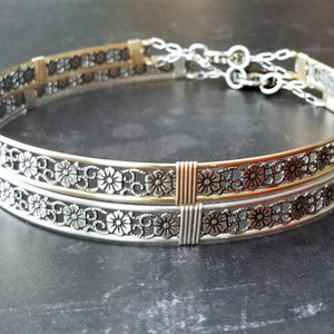 Our most delicate and feminine submissive locking collar. A simply sweet floral and vine pattern of sterling silver and wire wrapped with precious metal accents. BDSM? No one will know. Totally discreet.