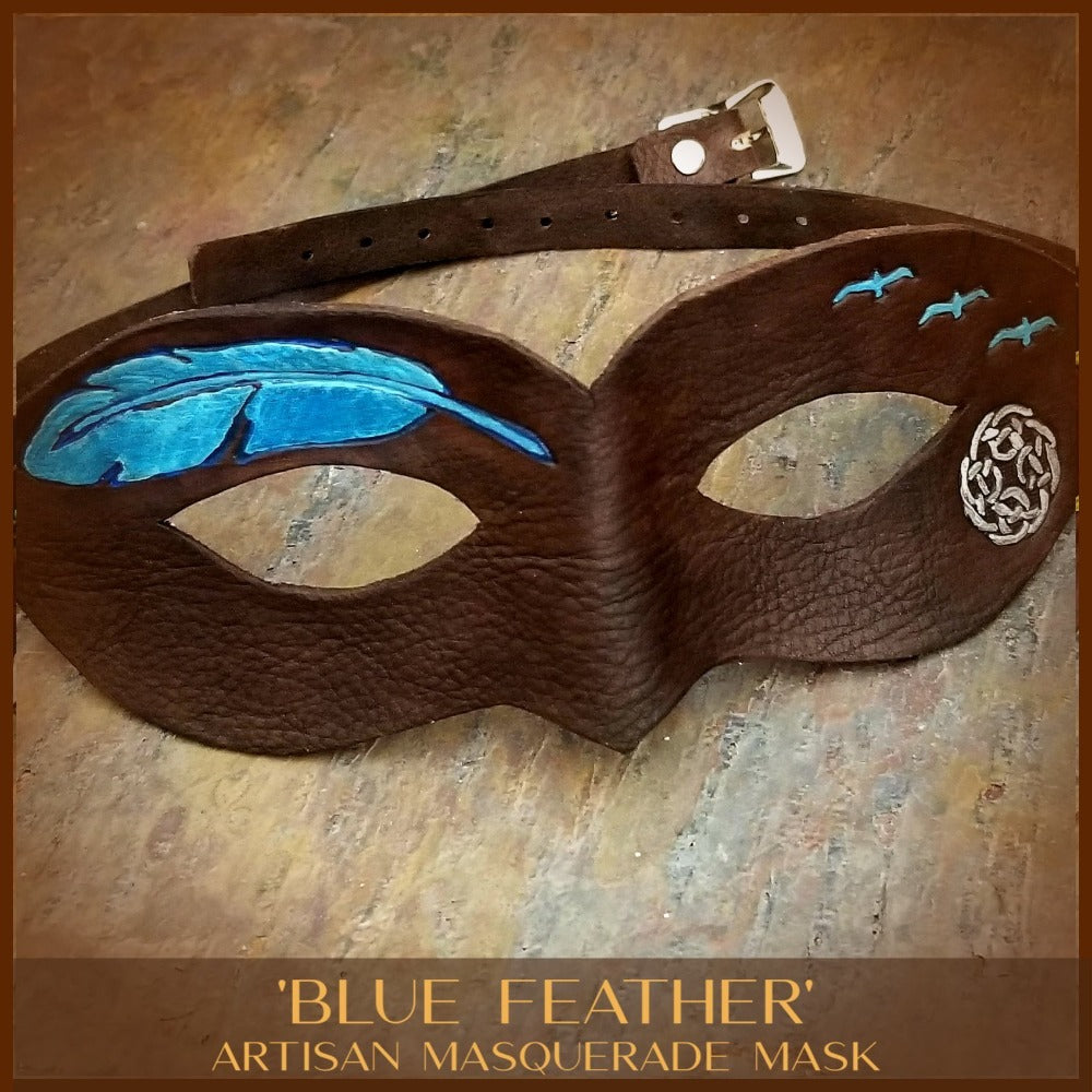 A One Of A Kind Leather Mask. Dark brown leather with blue feather, birds in flight and Celtic knot. The soft and supple leather is high quality milled, single shoulder leather, with nice leather smell and soft texture on the inside. It will become uniquely yours with use. 