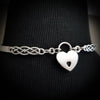  A Celtic inspired locking submissive collar that's sleek and clean in the front, and embellished with Celtic knots in the back. Or... reverse it and wear the decorative design in the front with the lock, for a bold statement of Ownership. Since it's unadorned in the front, you can easily change the look with collar enhancers / slides.