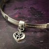 Symbolizing eternity love, this Celtic Heart is a sweet reminder of your love. Features a sterling silver chain, but can be worn on most of our BDSM locking submissive collars. Sterling silver.