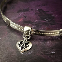 Symbolizing eternity love, this Celtic Heart is a sweet reminder of your love. Features a sterling silver chain, but can be worn on most of our BDSM locking submissive collars. Sterling silver.
