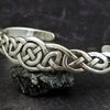 An intricate openwork Celtic weave design in all sterling silver cuff. Wear alone, or stack with some simpler designs for an bold look.