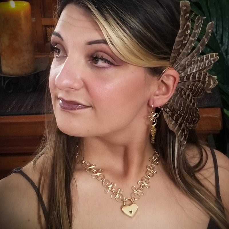 Made a bold statement of your Dominant / submissive lifestyle. The CELTIC PRIESTESS locking submissive collar features chain links inspired by Celtic knots, all created entirely by hand using only a few hand tools. The links are then tumbled with steel shot, creating strength and durability, as well as a silky smoothness. 